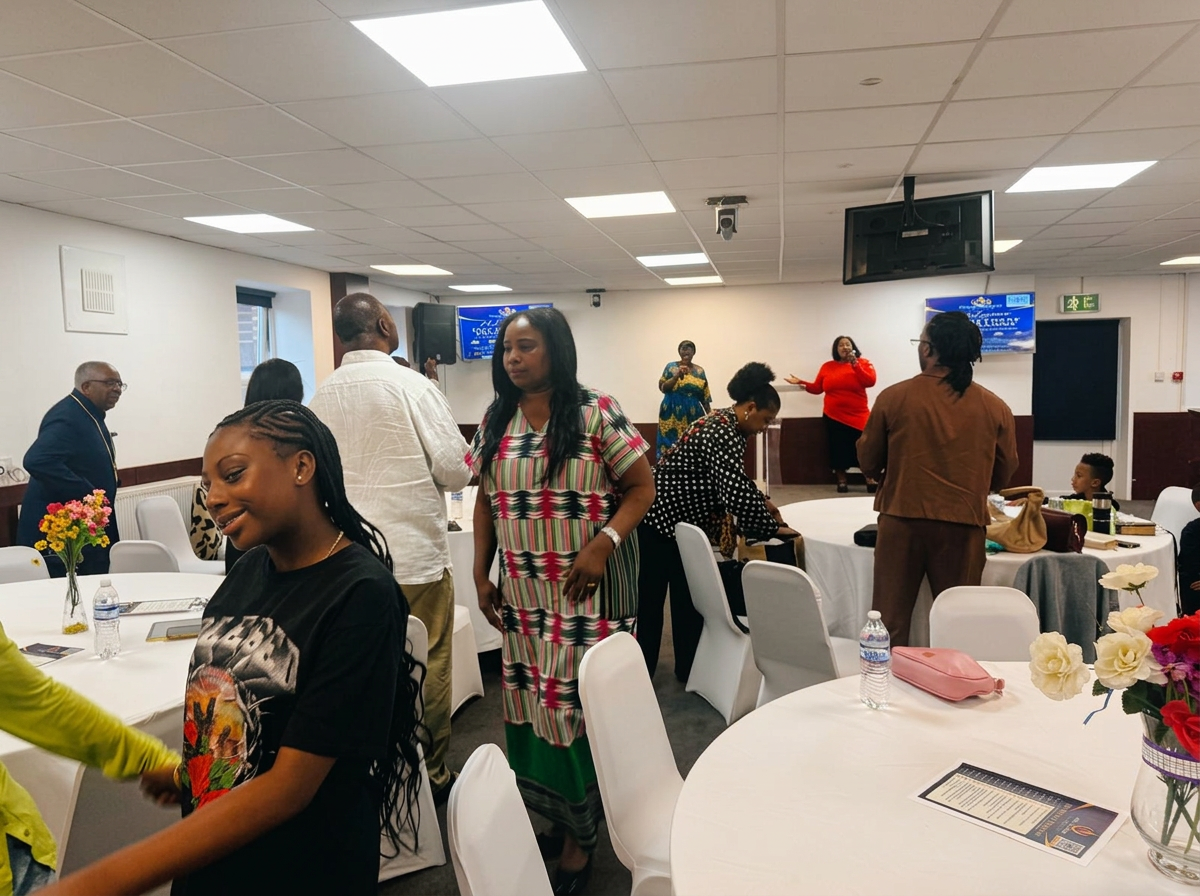 Attendees sharing fellowship around tables at the GCIM Day Retreat 2026